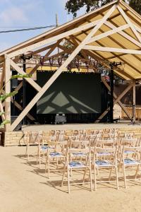 a group of chairs sitting in front of a stage at TAIGA Almeria Playa in Palomares