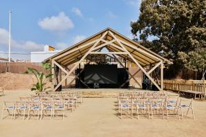 a group of chairs sitting in front of a stage at TAIGA Almeria Playa in Palomares