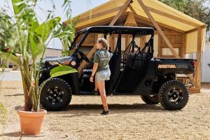 a woman standing in front of a golf cart at TAIGA Almeria Playa in Palomares