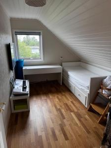 a small room with a bed and a window at Villa with a view in Morviki