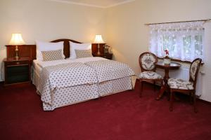 Llit o llits en una habitació de Hotel MERTIN