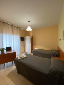 En eller flere senge i et værelse på Bella Vista B&B