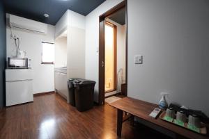 Kuchyň nebo kuchyňský kout v ubytování Guest House 伏見稲荷