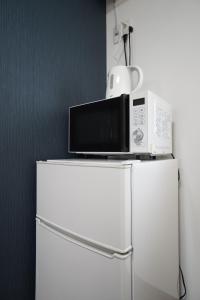 TV a/nebo společenská místnost v ubytování Guest House 伏見稲荷