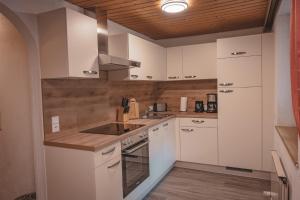 Kuchyň nebo kuchyňský kout v ubytování Haus Bergwind