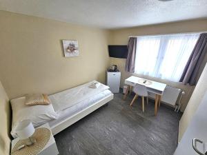 Voodi või voodid majutusasutuse Hotel Surselva toas