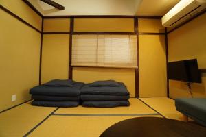 TV a/nebo společenská místnost v ubytování Guest House 伏見稲荷