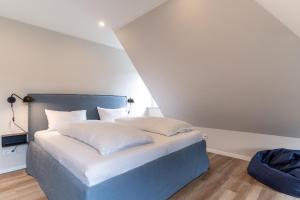 Letto o letti in una camera di Einzelhaus Huus Elphi Huus Elphi