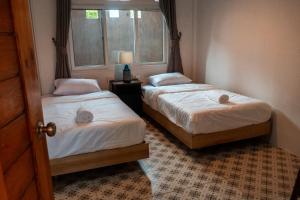 Postel nebo postele na pokoji v ubytování Closca Hostel Koh Tao