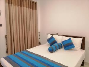 Postel nebo postele na pokoji v ubytování Golden Residence