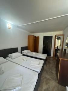 Postel nebo postele na pokoji v ubytování Hotel OBELISC