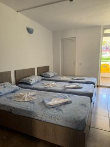 Postel nebo postele na pokoji v ubytování Hotel OBELISC