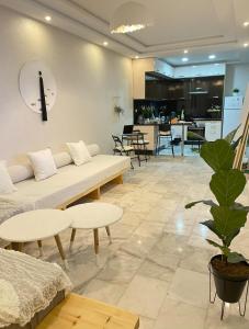 a living room with a couch and a table at Studio SvEt 19 in Mohammedia
