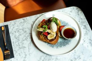 a plate of food on a table with a cup of tea at The Foundry in Belfast +26 photos