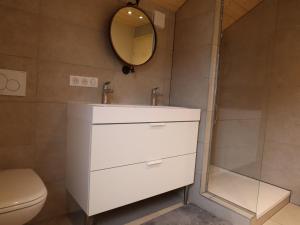 a bathroom with a white sink and a shower at Chalet rénové spacieux près des commerces, à 200m du village et du lac, navette ski-bus gratuite - FR-1-624-118 in Samoëns +12 photos