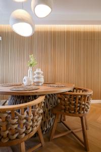 a dining room with a table and two chairs at Glyfada Platinum Résidence in Athens