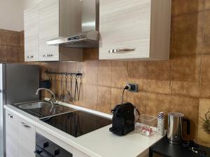 Kuchyň nebo kuchyňský kout v ubytování Ma Maison + 28 fotografií