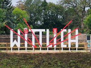 a large sign for a museum with red arrows at Ferienhaus Plan B. Wittlich in Wittlich