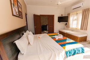 Postel nebo postele na pokoji v ubytování Villa Source D'Argent