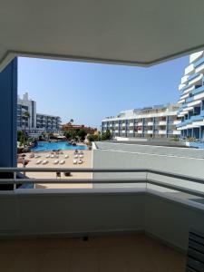 a balcony with a view of a beach and buildings at Zen Apartment Tenerife in San Miguel de Abona