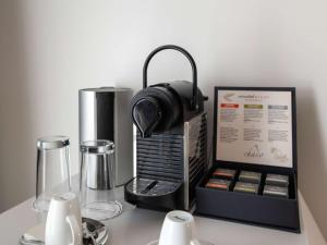a black appliance with headphones on top of a table at Swissôtel Resort Bodrum Beach in Turgutreis