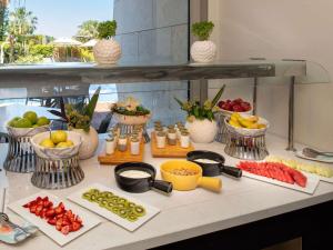 a buffet with fruits and vegetables on a table at Swissôtel Resort Bodrum Beach in Turgutreis