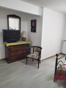 TV a/nebo společenská místnost v ubytování A casa di Luigi