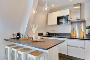 Kuchyň nebo kuchyňský kout v ubytování OIQIA • Intemporel