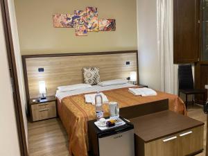 Postel nebo postele na pokoji v ubytování B&B Duomo Apartament