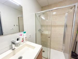 a bathroom with a shower and a sink at Trinidad del Mar Turistea in Castellón de la Plana
