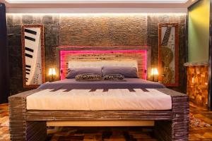 Ένα ή περισσότερα κρεβάτια σε δωμάτιο στο Ocean Suites