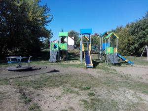 a group of playground equipment in a park at Owk Korona in Mikoszewo