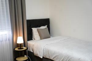 Postel nebo postele na pokoji v ubytování TEN Guest House