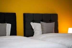 Postel nebo postele na pokoji v ubytování TEN Guest House