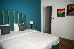 Postel nebo postele na pokoji v ubytování TEN Guest House