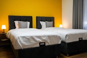 Postel nebo postele na pokoji v ubytování TEN Guest House