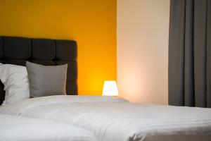 Postel nebo postele na pokoji v ubytování TEN Guest House