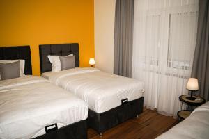 Postel nebo postele na pokoji v ubytování TEN Guest House