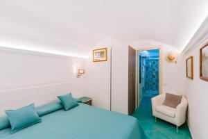 Postel nebo postele na pokoji v ubytování B&B IL CORTILE