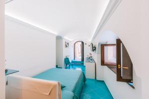 Postel nebo postele na pokoji v ubytování B&B IL CORTILE