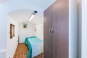 Postel nebo postele na pokoji v ubytování B&B IL CORTILE