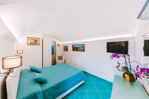 Postel nebo postele na pokoji v ubytování B&B IL CORTILE