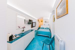 TV a/nebo společenská místnost v ubytování B&B IL CORTILE