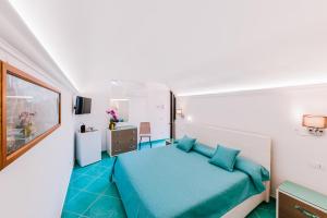 Postel nebo postele na pokoji v ubytování B&B IL CORTILE