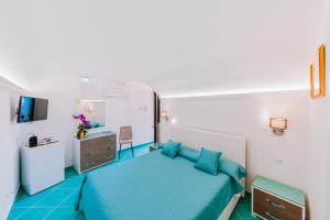 Postel nebo postele na pokoji v ubytování B&B IL CORTILE