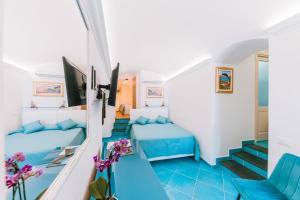 TV a/nebo společenská místnost v ubytování B&B IL CORTILE