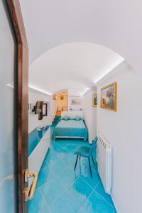 Postel nebo postele na pokoji v ubytování B&B IL CORTILE