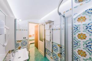 Koupelna v ubytování B&B IL CORTILE + 22 fotografií