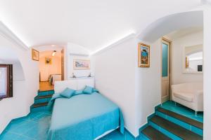 Postel nebo postele na pokoji v ubytování B&B IL CORTILE