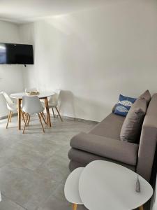 a living room with a couch and a table at Aniva in Drage